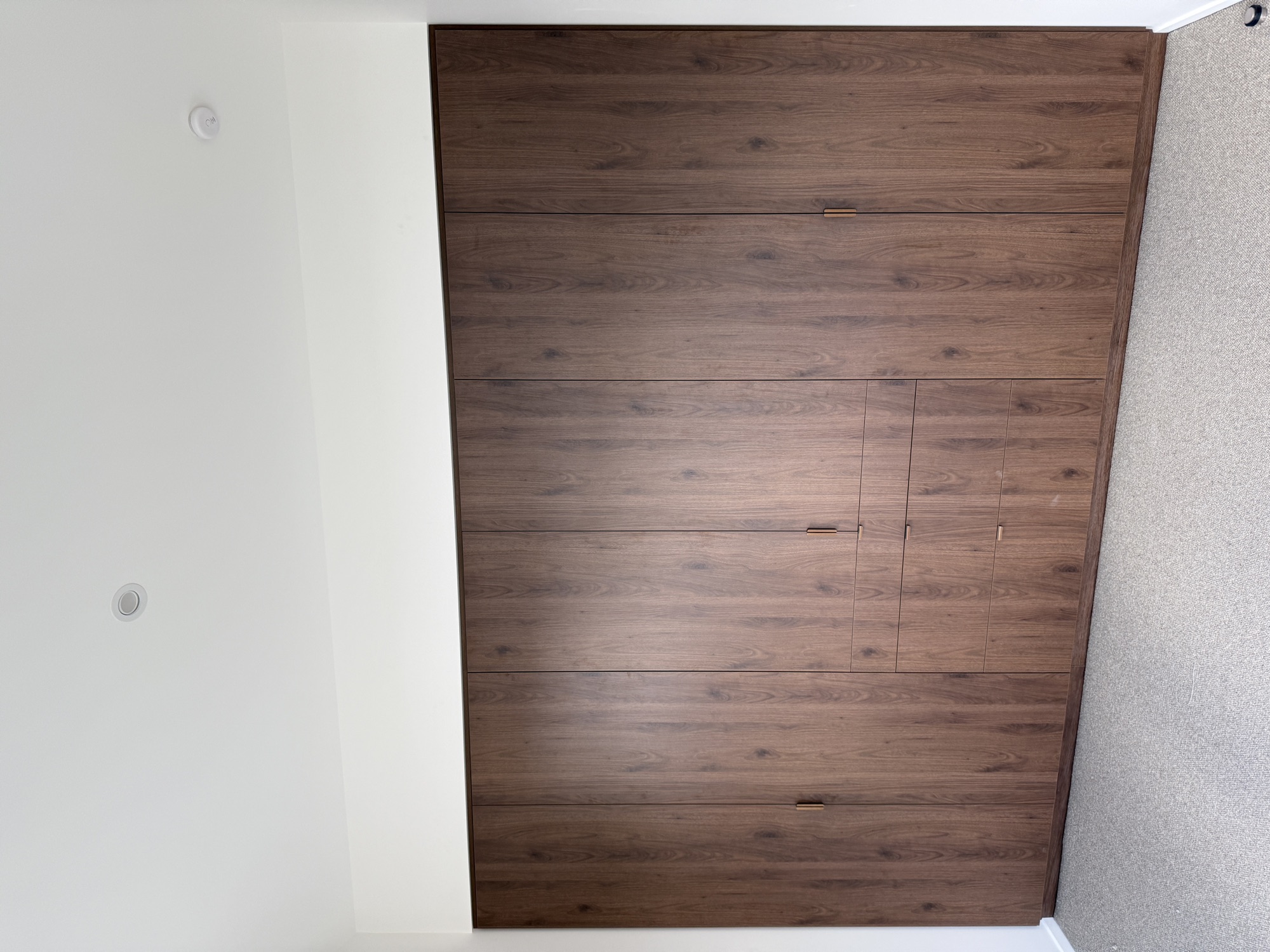 Full height timber joinery wall with integrated doors